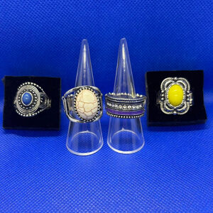 Set of 4 silver-tone stretch rings with colorful faux stones and rhinestones